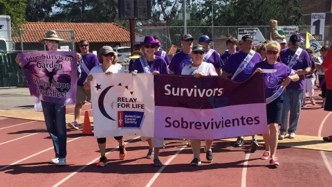 people walking at relay for life survivor walk
