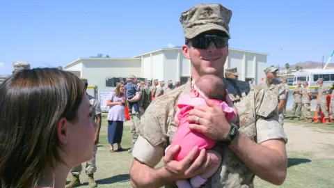 marine holding baby