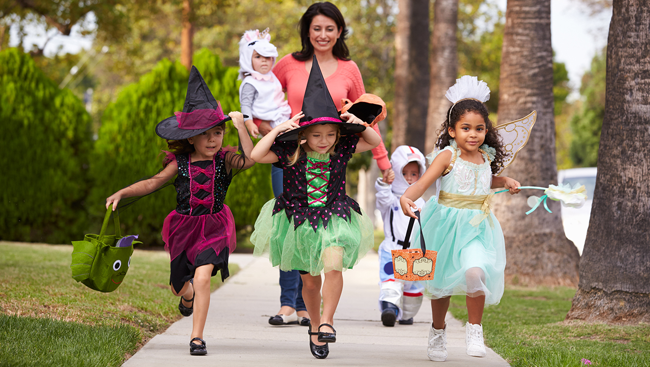 kids trick or treating with mom