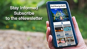 Stay Informed Subscribe to the eNewsletter persons hand holding smartphone showing the eNewsletter