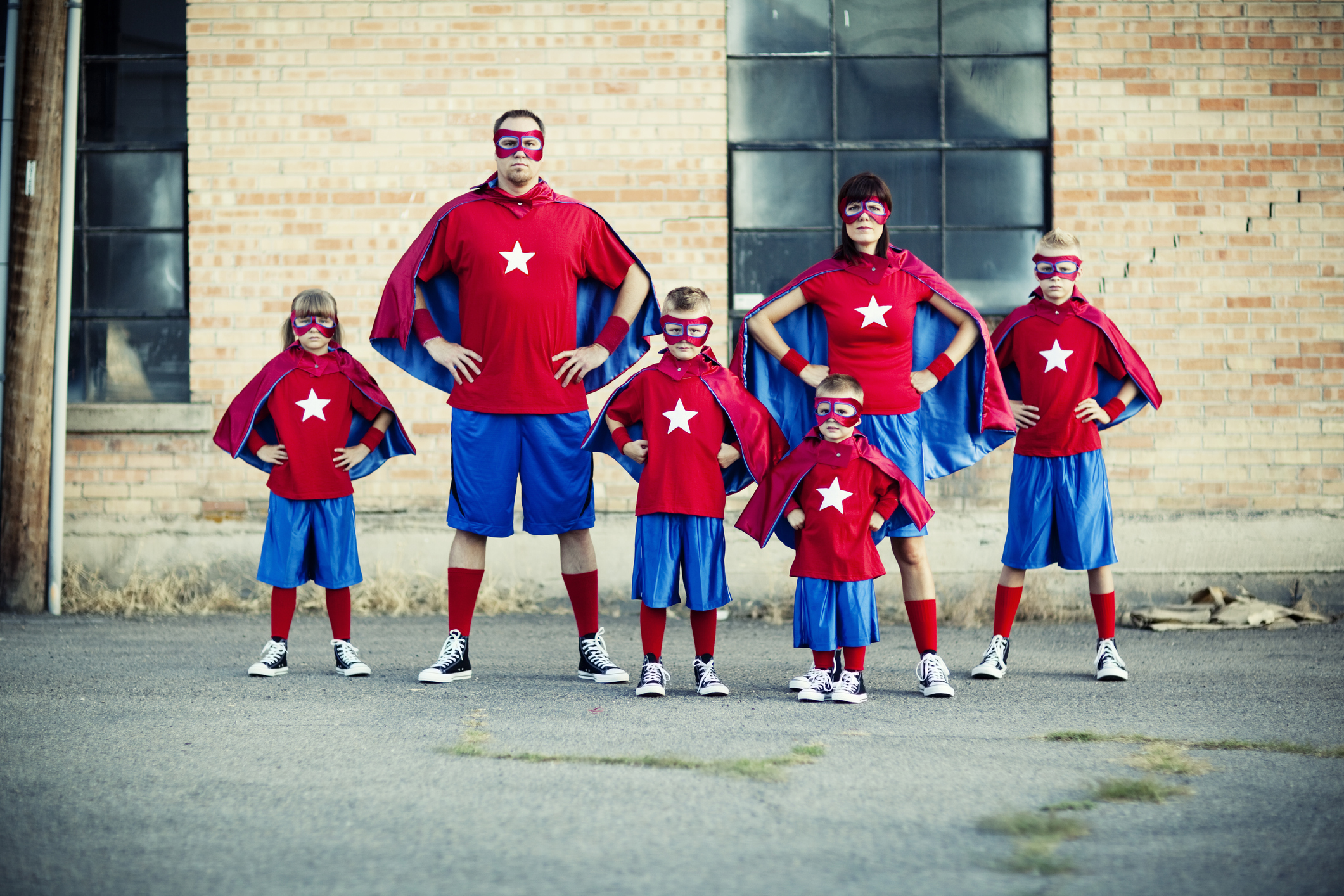 family dressed as superheroes