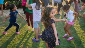 Children dancing on the Grass