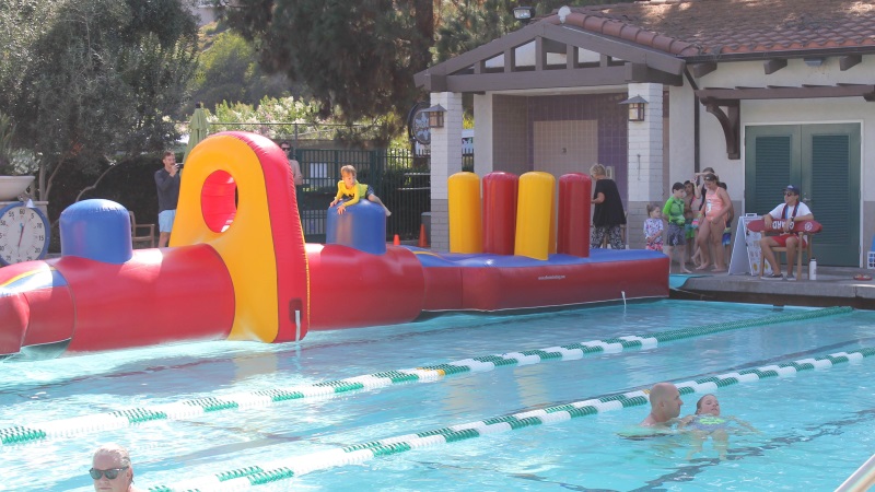 inflatable obstacle course on pool
