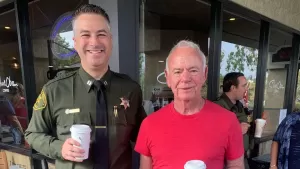 Sheriff with a resident having coffee
