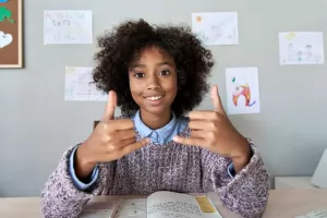 child using American Sign Language