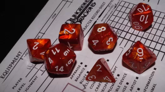 A collection of red polyhedral dice