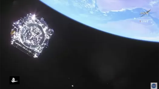 NASA James Webb Space Telescope viewed in space with a portion of the Earth in view