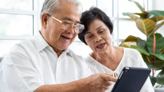 Adult couple with tablet
