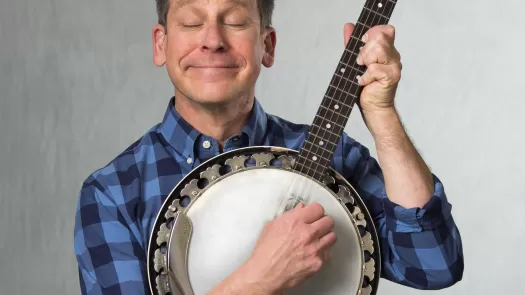 Jimm Gill holding banjo
