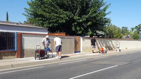 people working on the wall