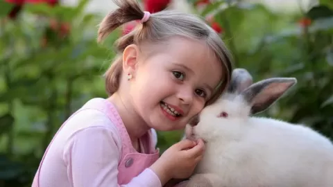 young girl with rabbit