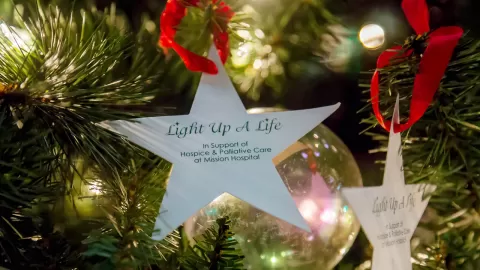 Light up a life ornament on tree