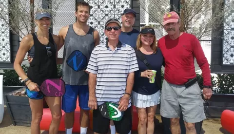 pickleball players posing for photo
