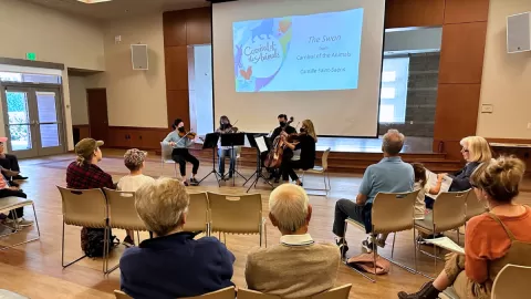symphony in community center playing instruments