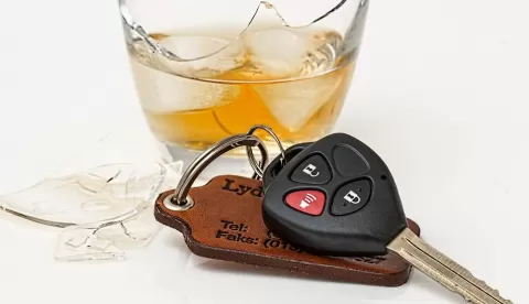 car keys and glass of alcohol