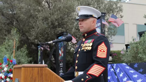 military colonel at lectern