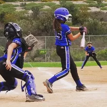 girls playing softball