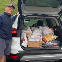 man with car full of pet donations