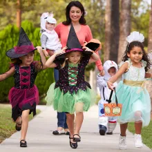 kids trick or treating with mom