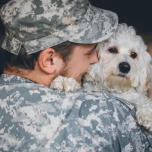military person with dog