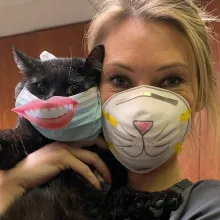animal shelter employee with cat
