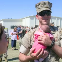 marine holding baby