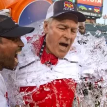 Coach Johnson being dumped with a bucket of water