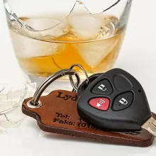 car keys and glass of alcohol