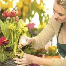 woman working on flower arrangement