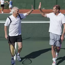tennis players high fiving