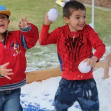 kids throwing snowballs