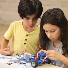 kids making car out of legos