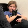 child holding cat