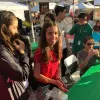 Teens around a table at Santa Arrival Booth