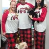Family Dress in Christmas Pajamas with two Dogs