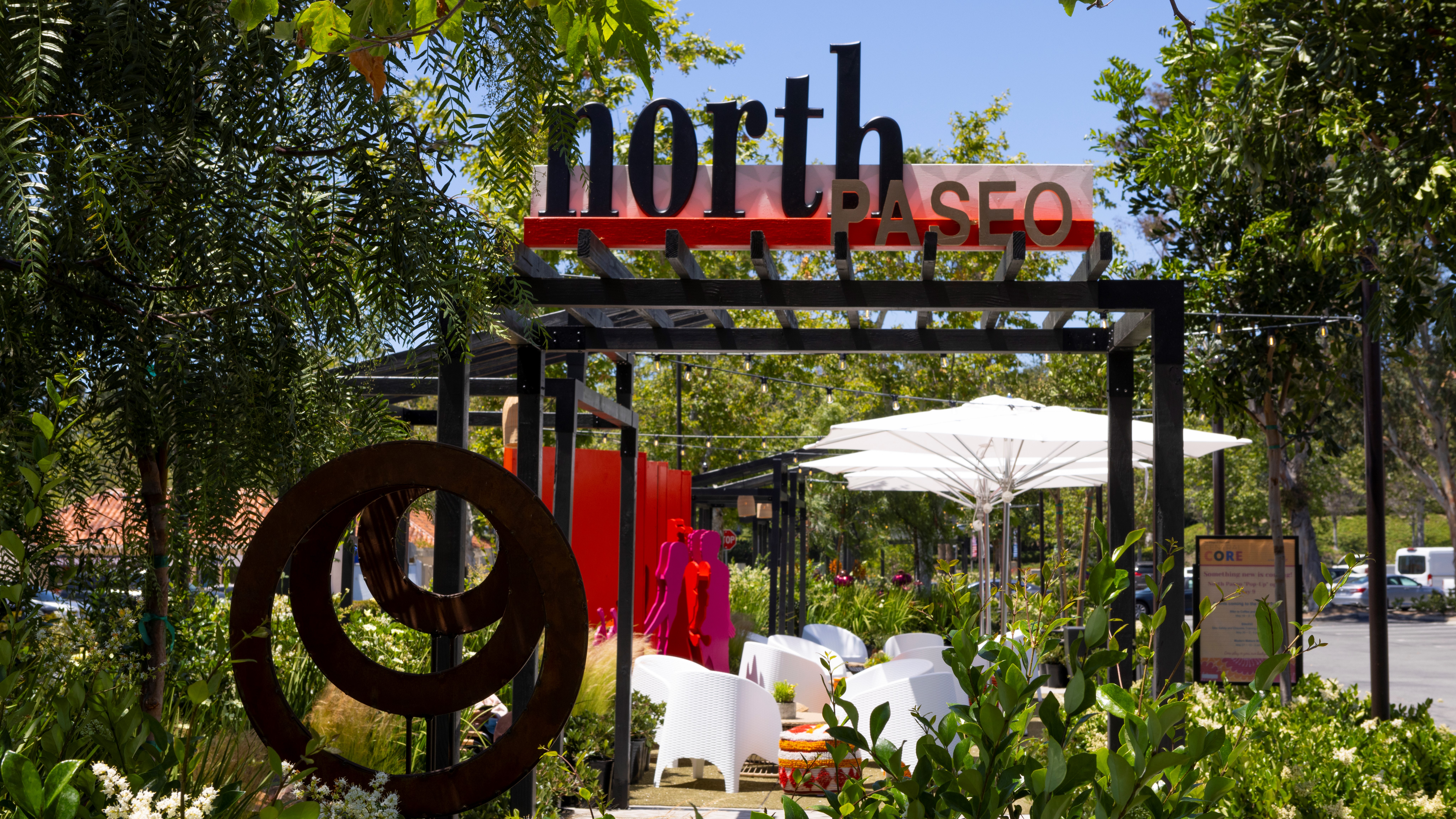 North Paseo entry way with seating and greenery
