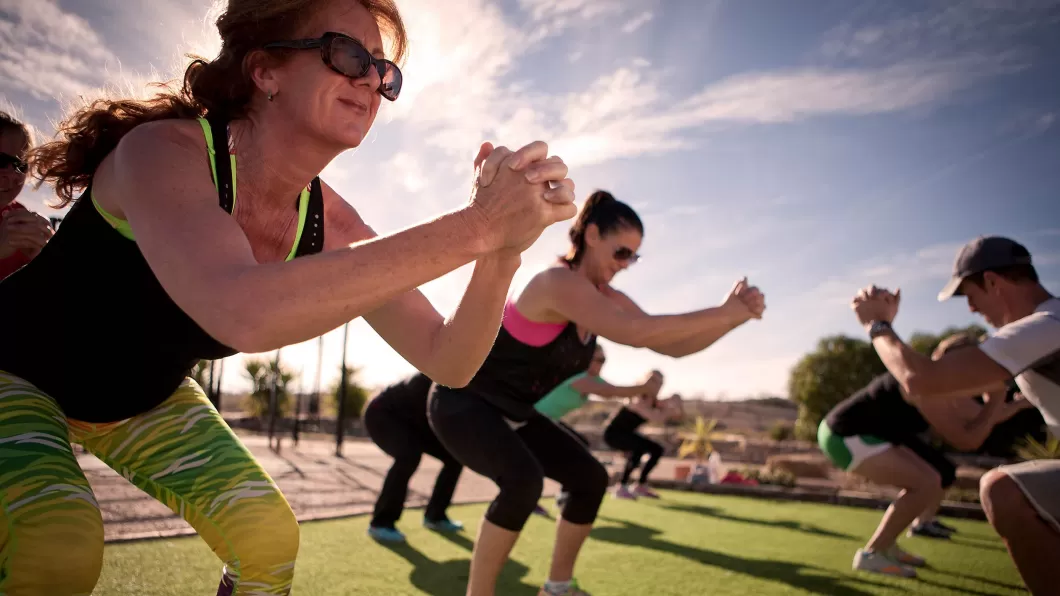 People working out in a bootcamp fitness class