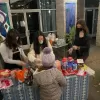 Teens decorating candy houses